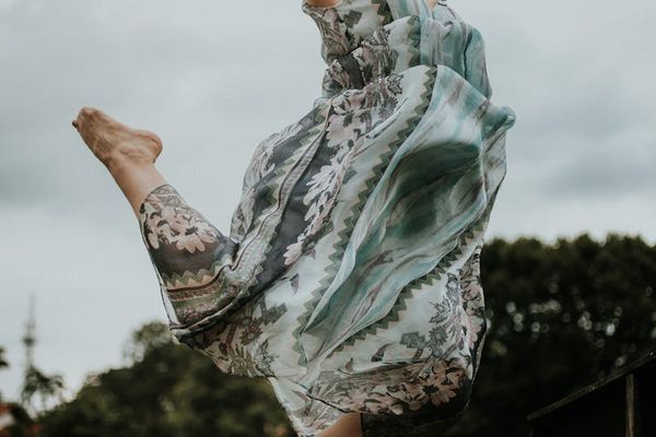 A person captured in a dynamic, flowing movement.